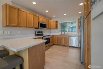 The kitchen has new quartz countertops that match the bathroom counters. The upper corner cabinets on either side of the sink both have Lazy Susan's and the lower corner cabinets do as well.  So, lots of orgainizational upgrades in this house.