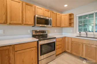 All appliances stay. Under the kitchen sink is a Reverse Osmosis Water Treatment System.  The rest of the house is served by a Water Softening System, which sits in the garage.