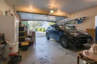 The attached 2 car garage is extra deep for toys! Currently, sellers have extra cabinet storage.