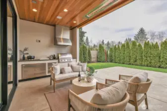 Outdoor covered patio with two infrared heat  lamps and built in kitchen