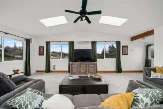 Another view of the Huge Great Room/Family Room. Drenched in Natural Light, and surrounded by windows, this Family Room is a truly a Multi-functional, Versatile Space.  This smart floor plan includes 2 Bedrooms Up & 3 Bedrooms Down with a variety of Bedroom configurations that can be used to fit all of your individual needs.