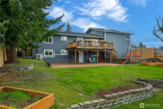 This large backyard has plenty of space for children and pets to roam and run around, and also plenty of places for adults to enjoy their own activities or sit, relax and enjoy some down time!