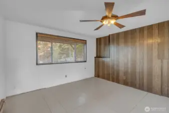 Primary bedroom with window to the yard