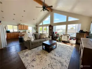 Great room living area with cathedral ceiling with great views! Enjoy the amazing sunrises while waking up with your morning coffee time.