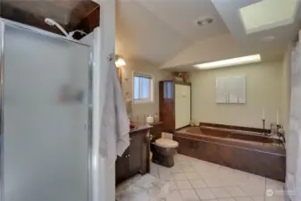 Primary has tub and walk-in shower
