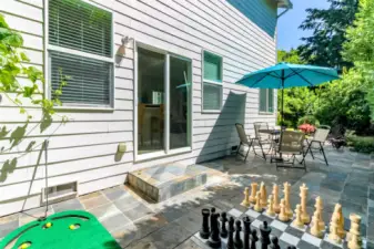 Large Back patio with built-in Chess board and practice your putting!