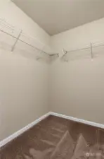 walk in closet in primary bedroom