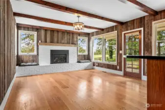 Sunken Family room off of kitchen area. Gas fireplace with storage below.