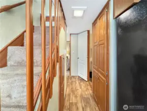 A peek down the hallway toward the bathroom and primary bedroom.