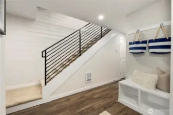 Imagine that....a front foyer!  Features include 2 storage closets, a built in bench with storage, hanging hooks and lots of space to add your personal art and furniture.