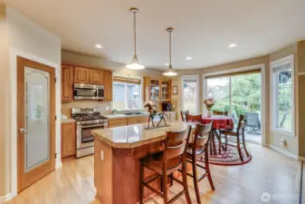 Island with breakfast nook. Walk in pantry.