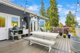 The large deck can be easily accessed from the main living area. Enjoy outdoor dining, cocktails and BBQ's