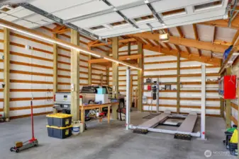 9 foot door leads you to this side of shop that is 33 feet deep. Plenty of room for all your toys, this lift is staying!