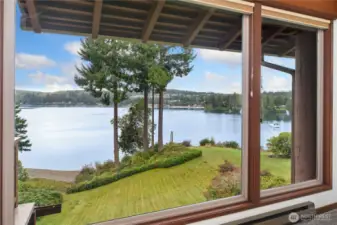 The lawn leads down to a beach where you can put your kayak in!