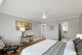 The generous primary bedroom suite layout offers space for a king-size bed, large furniture, designated seating areas and large screen tv.