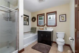 Full guest bathroom with door to one of the main floor bedrooms