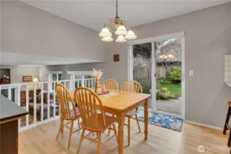 Kitchen features an eating area that leads to the outdoor living and entertainment space.