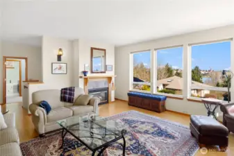 Living room with bamboo floors and great views. Here we can see Kah Tai Lagoon. On the left is the door to the primary bedroom suite and the stairway to the entry and lower floor. One can live mostly on this view floor.