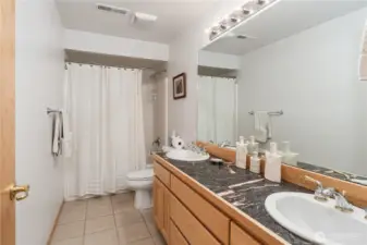 Hall Bath is a full bath with double sinks.