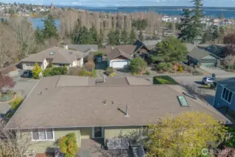 Drone view catching the back of the home and the view beyond.