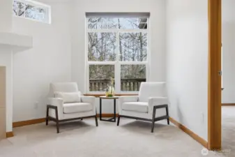 A sitting area to watch nature at the stream beyond the deck.