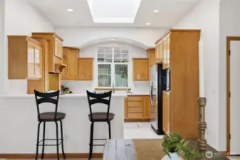 The kitchen is quite spacious and has an abundance of storage and counterspace.