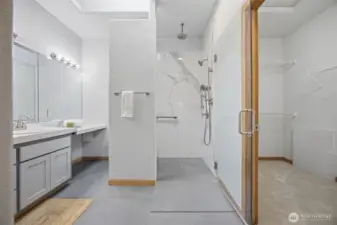 Another view of the primary bath (there is a separate toilet room) with the walk-in closet to the right.