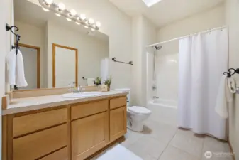 The full bath is adjacent to the 2nd bedroom and near the den/office at the front entry.