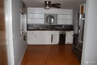 Kitchen with sliding glass door to the left.