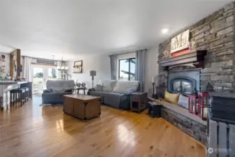 Living Room, Stone Fireplace with Wood Mantel, Beautiful flooring.  Very Open Concept