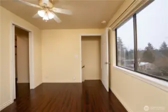 Heading upstairs from the flex room, is the primary bedroom with lovely territorial views.