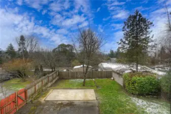 Large, fully fenced back yard with so very many possibilities.