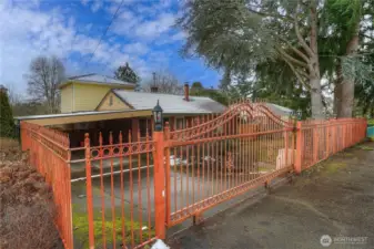 Rolling gate is electric for easy entrance.