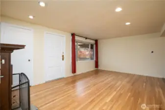 Entering, one is greeted by the gleaming, newly refinished hardwood floors.