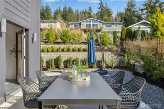 The backyard patio. There is extensive cement work and custom landscaping thought this property.