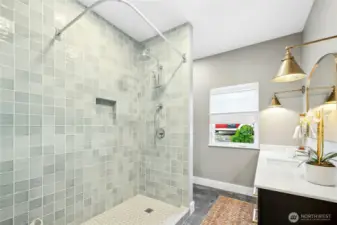 The main floor has a handy 3/4 bathroom with a spacious, custom-tiled shower.