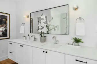 The primary bathroom with modern, high-end fixtures.