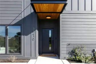 A convenient and practical covered front porch welcomes you home and greets your guests.