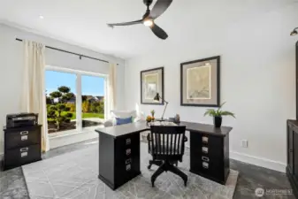 The main floor home office is a wonderful, flexible space with mountain views.