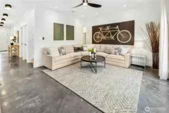 The spacious main floor living room opens out to the back yard and connects nicely to the kitchen too.