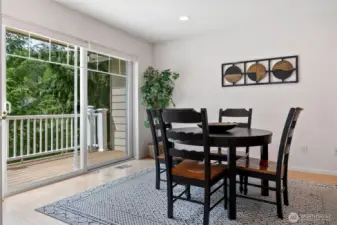 Kitchen eating area that brings in light from sliding unit.