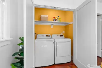 an auto lit laundry area is one of the many features this home offers
