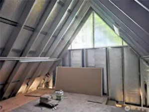 The bedroom upstairs is prepped for bedroom with an in-suit bathroom.