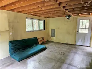 There was once a wood stove against the far wall here. It would need to be re-installed.