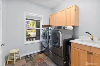 Laundry room with sink on main floor.