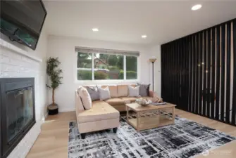 Bright living room with energy-efficient windows and bold custom wood accent wall.