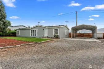 Side shot with a giant carport!