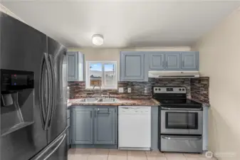 Kitchen with a window overlooking the backyard!