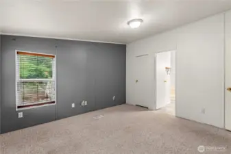 Primary bedroom leading into the primary bathroom!
