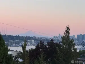Sunset over Lake Union from your private balcony